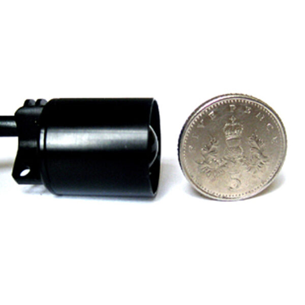 Photo showing the how small the LED lights for loupes are, comparable to a five pence coin