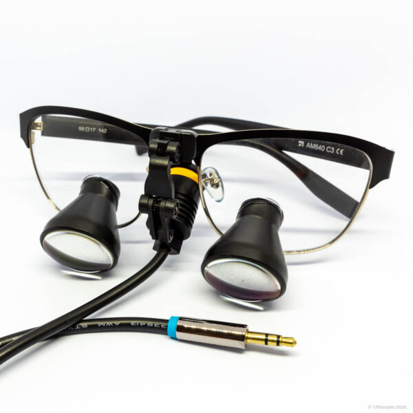 TTL loupes with light folded back with black frame by UKloupes